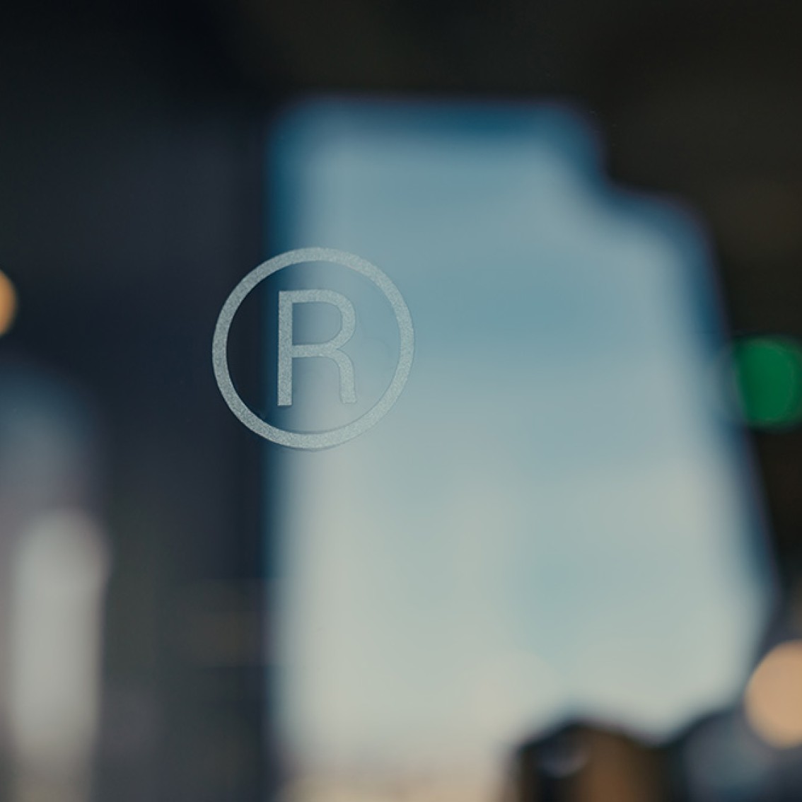 Ikon for registrert varemerke, med en R i en sirkel.