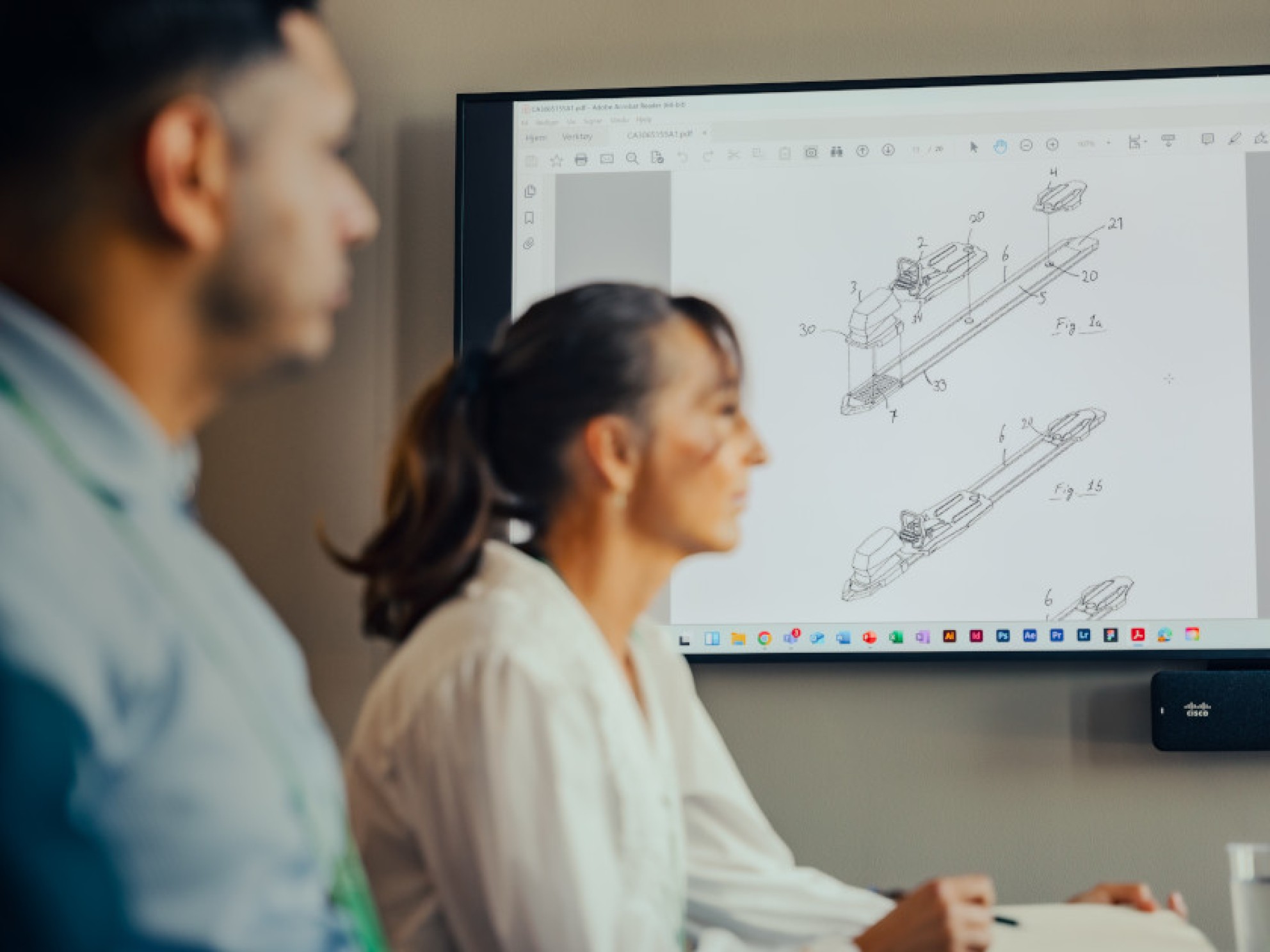 NIPO's employees are looking at a technical drawing