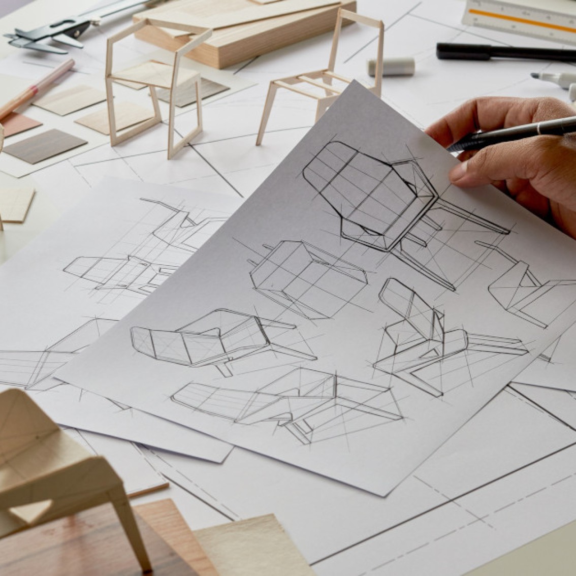 Miniature chair models in different designs.