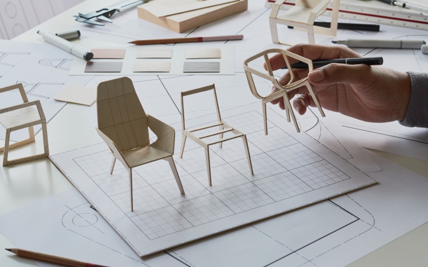 Miniature chair models in different designs