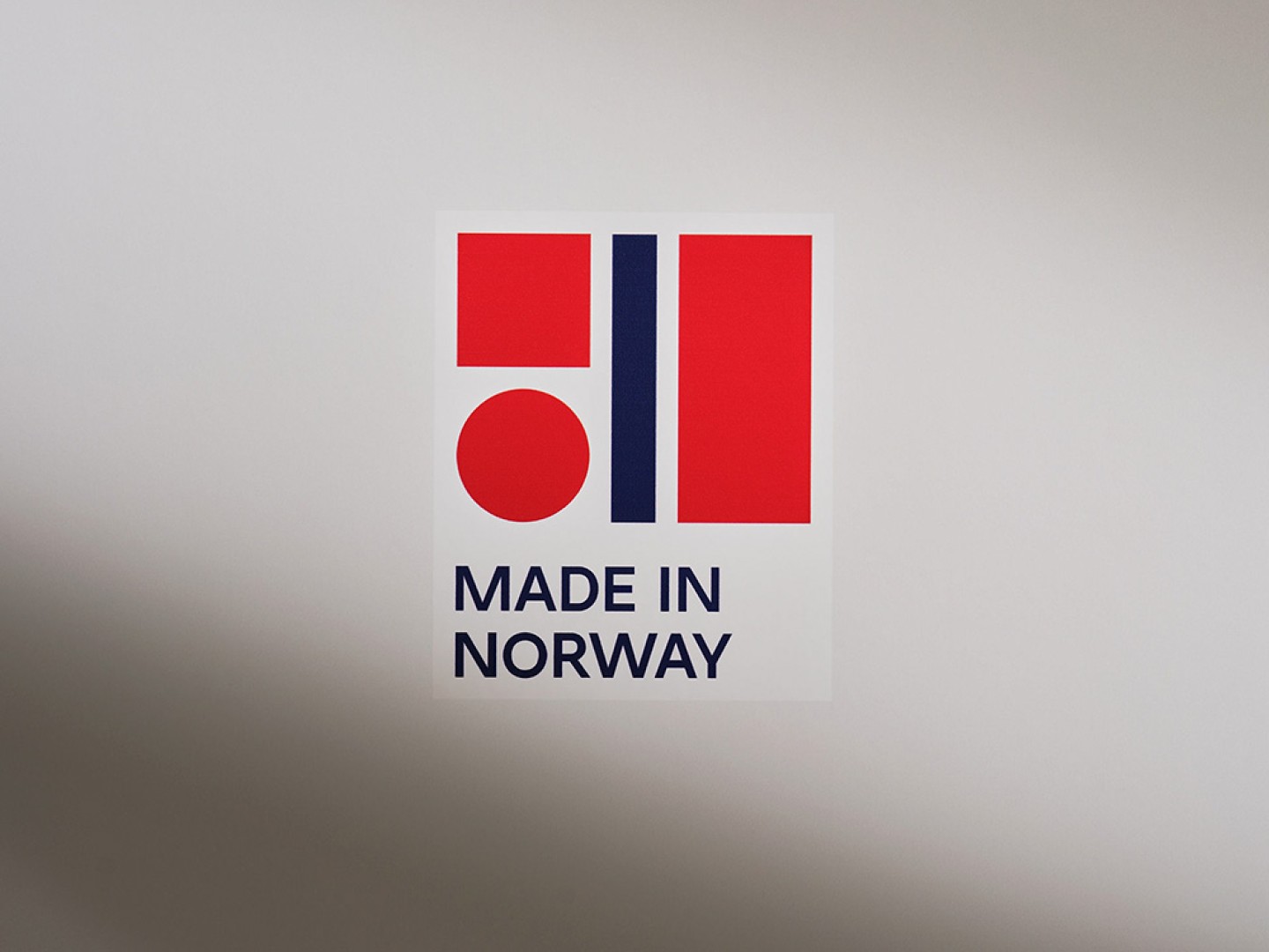 Logo for Made in Norway in red and blue on a white background.