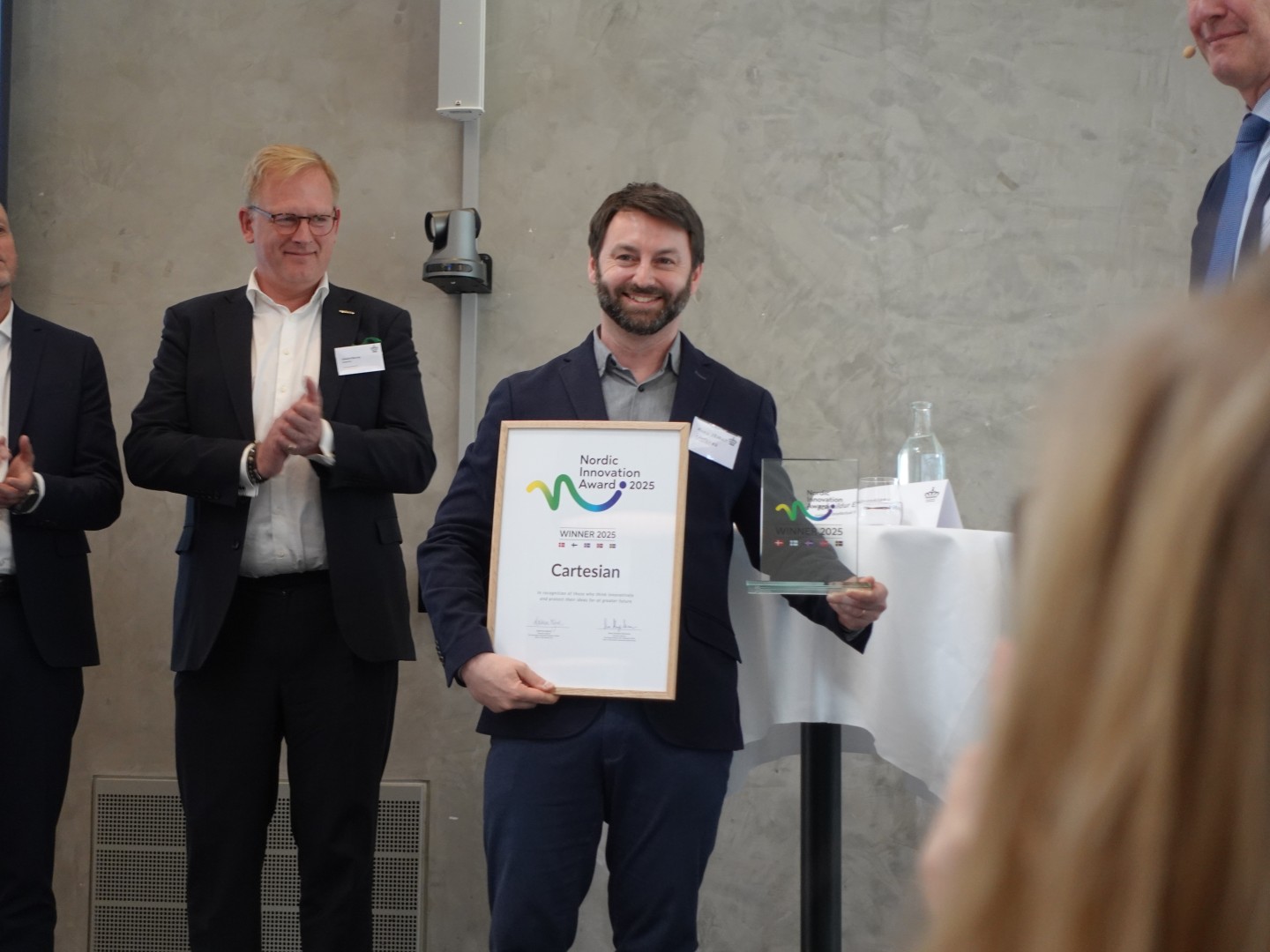 Alexis Sevault shows off the award right after Cartesian was named winner of the Nordic Innovation Award 2025.